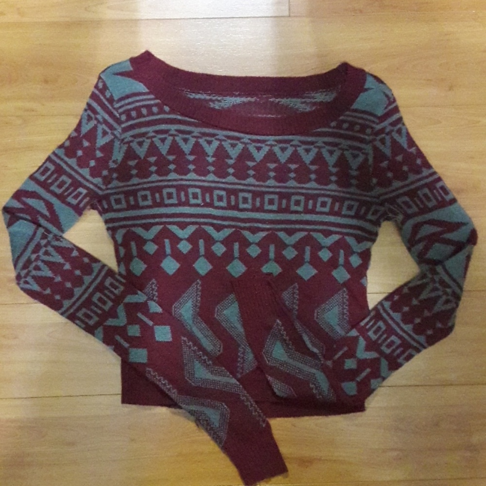 A long sleeve burgundy swearshirt